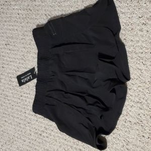 New from Amazon, black women's running shorts with a liner and pocket, M